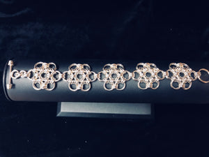 Full view of seaXwolf handmade fine jewelry signature HexaFleur Daisy Chain, solid sterling silver chain mail bracelet based on sacred geometry of the hexagon flower.