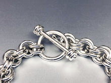 Closeup of Seaxwolf handcrafted extra chunky sterling silver 12 gauge double link bracelet with designer clasp for men and women.