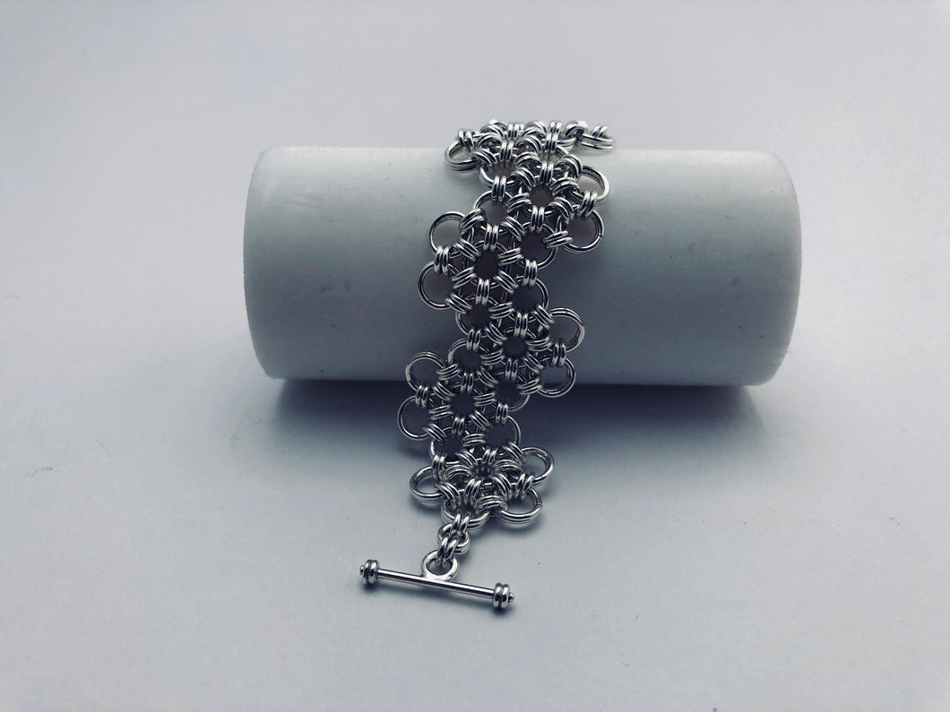 seaXwolf handmade fine jewelry signature HexaFleur Undulating, solid sterling silver chain mail bracelet based on sacred geometry of the hexagon flower.
