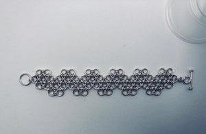 seaXwolf handmade fine jewelry signature HexaFleur Undulating, solid sterling silver chain serpent bracelet based on sacred geometry of the hexagon flower.