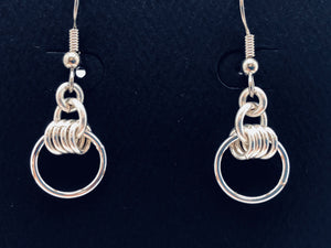 Seaxwolf handmade sterling silver four rings and a hoop unique earrings.